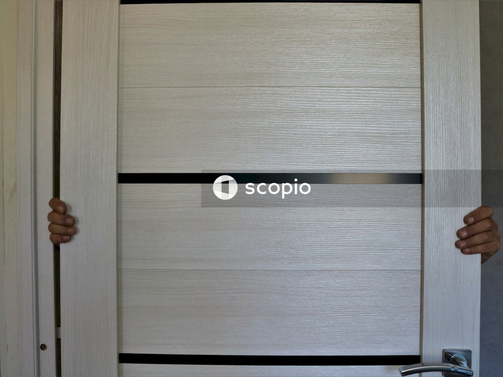 Person holding brown wooden cabinet
