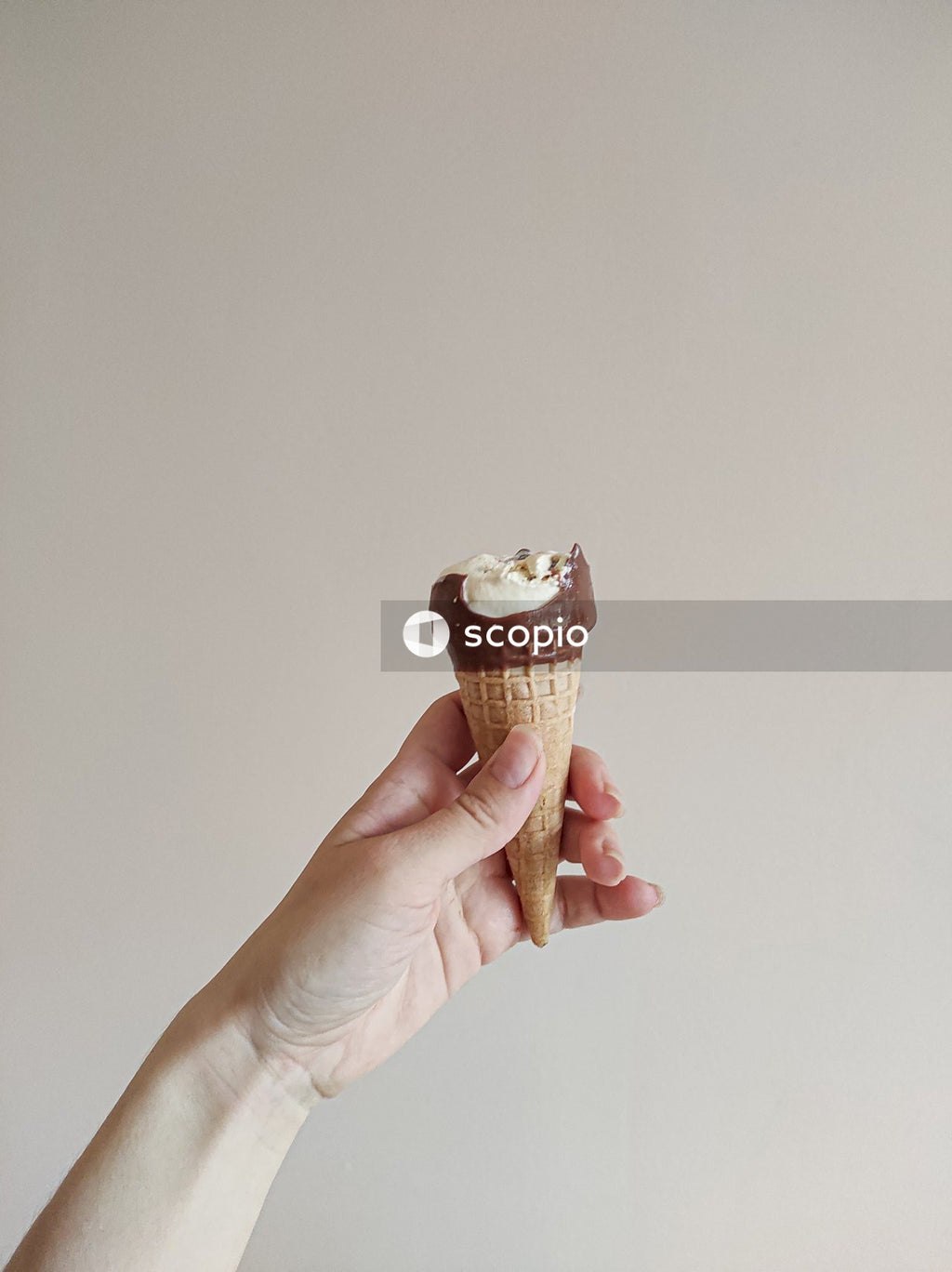 Person holding ice cream cone