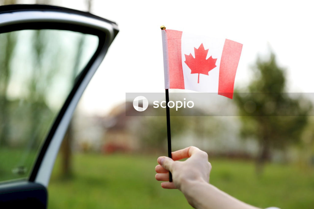 Person holding red and white star flag