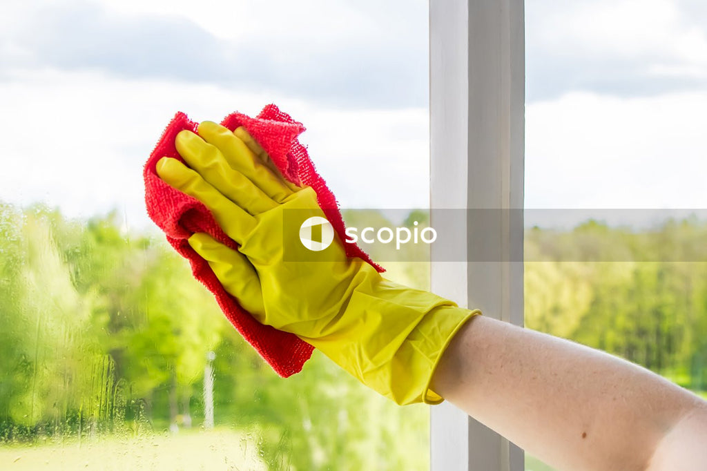 Person holding red and yellow textile