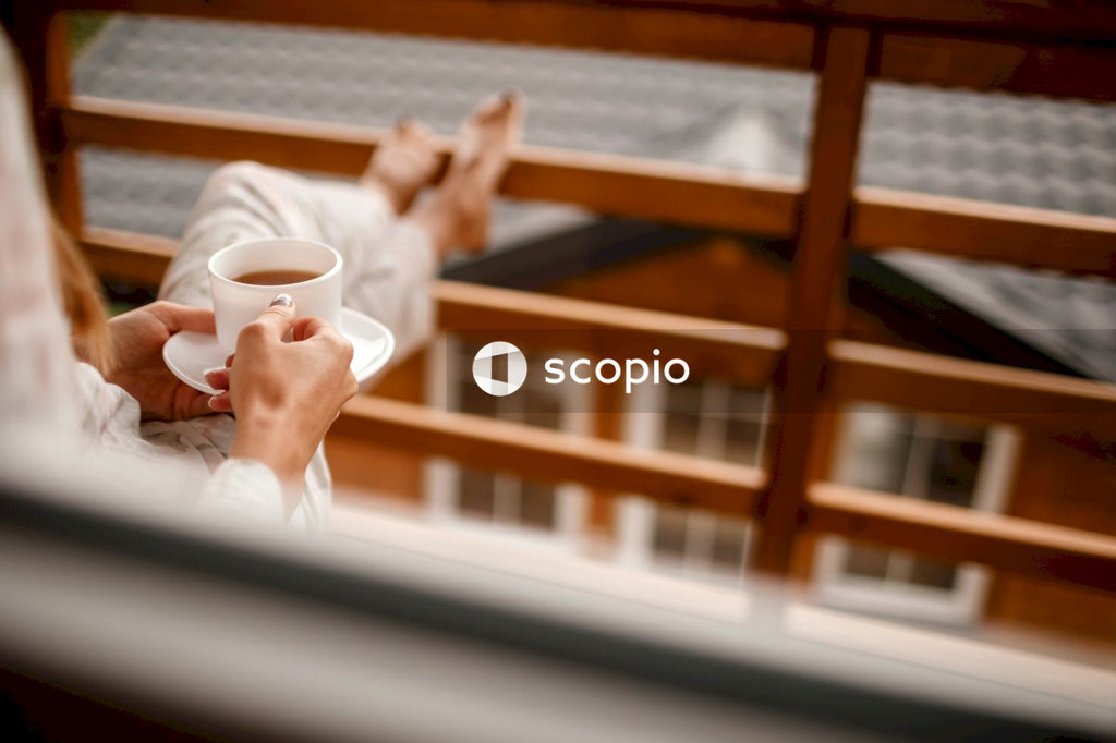 Person holding white ceramic mug