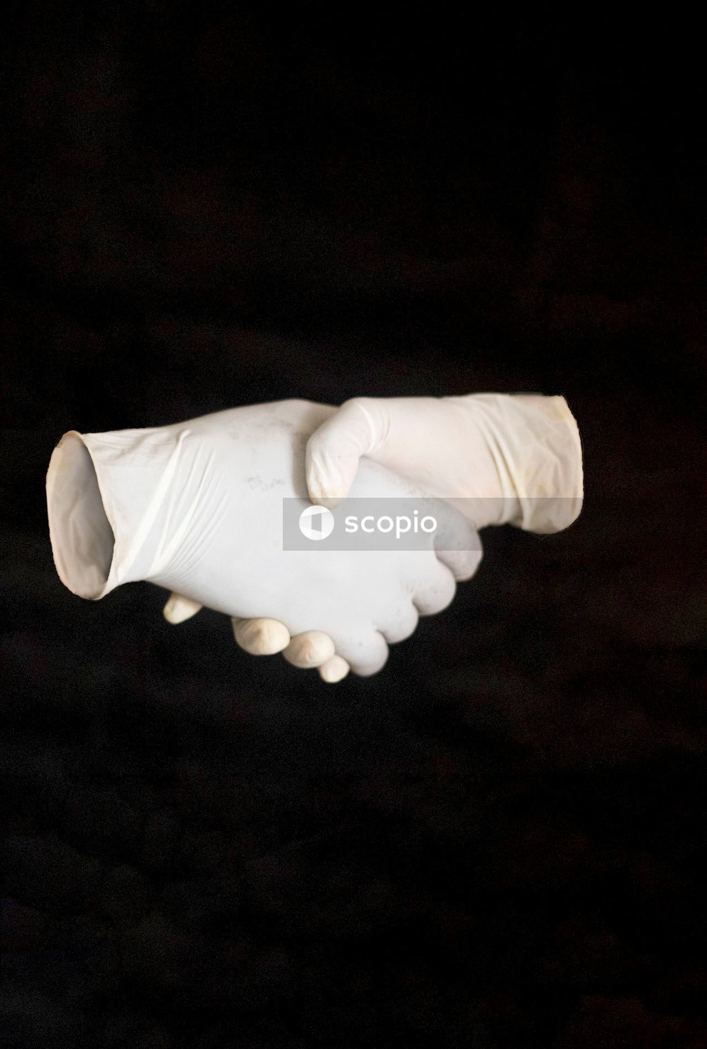 Person holding white ceramic mug