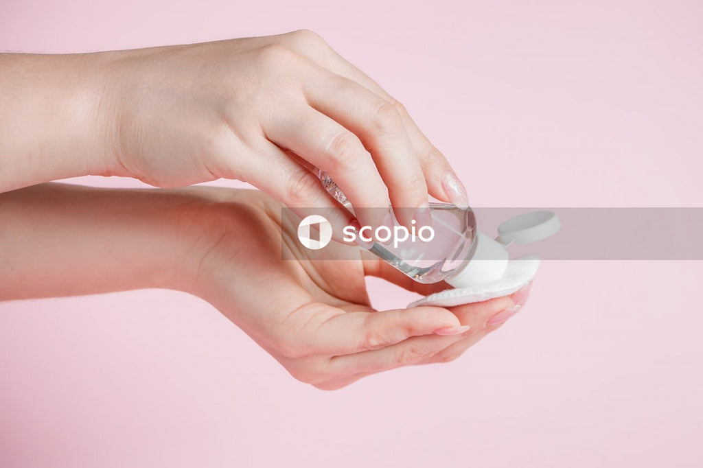 Person holding white ceramic teacup