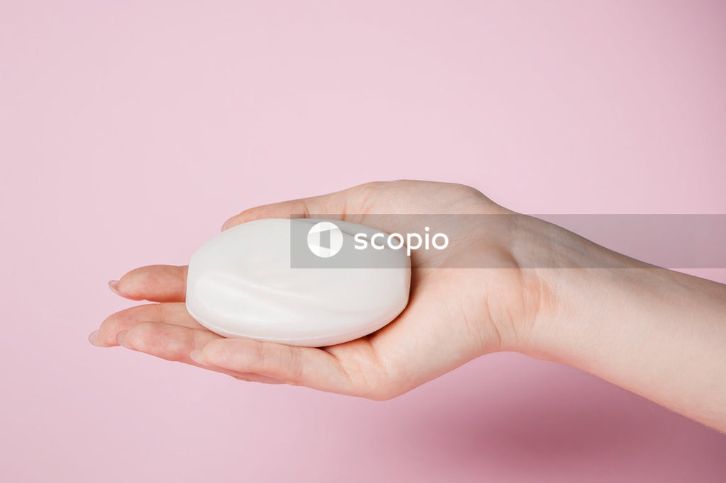 Person holding white egg shell
