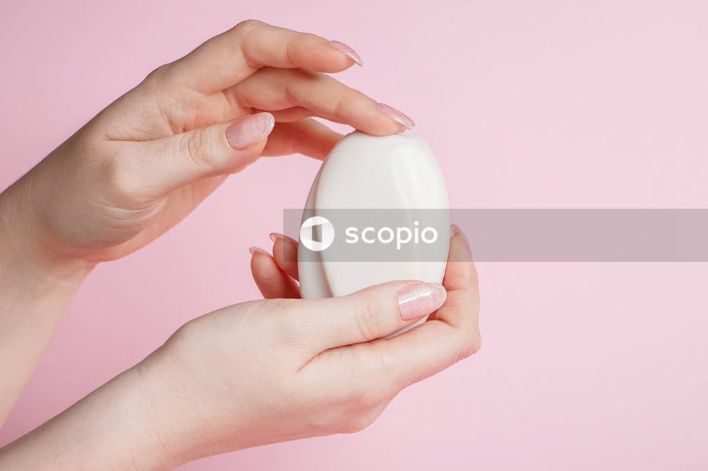 Person holding white egg shell