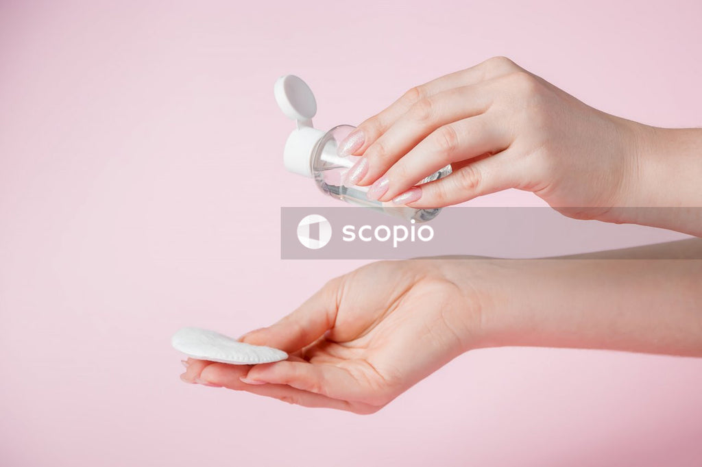 Person holding white heart shaped candy