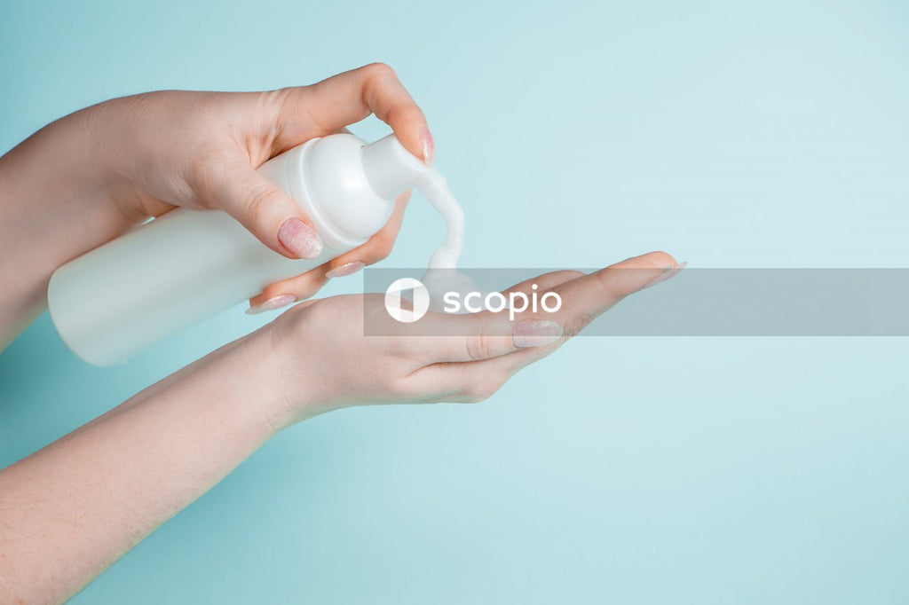 Person holding white plastic tool
