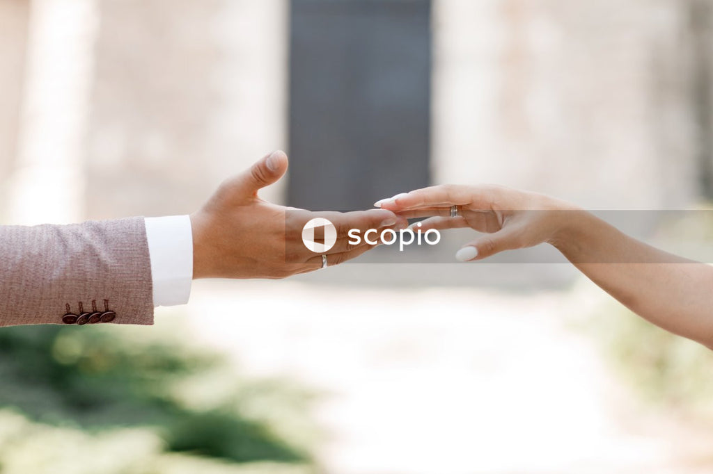 Person in white long sleeve shirt holding hands
