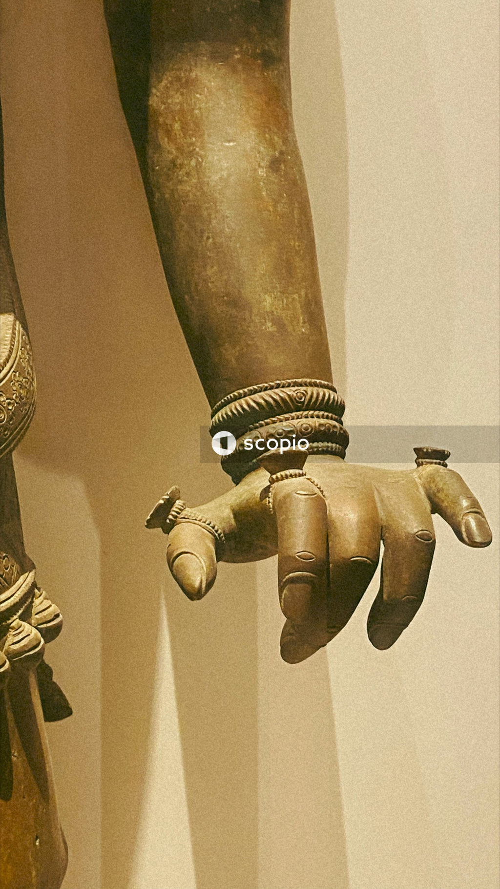 Person wearing gold and silver bracelet