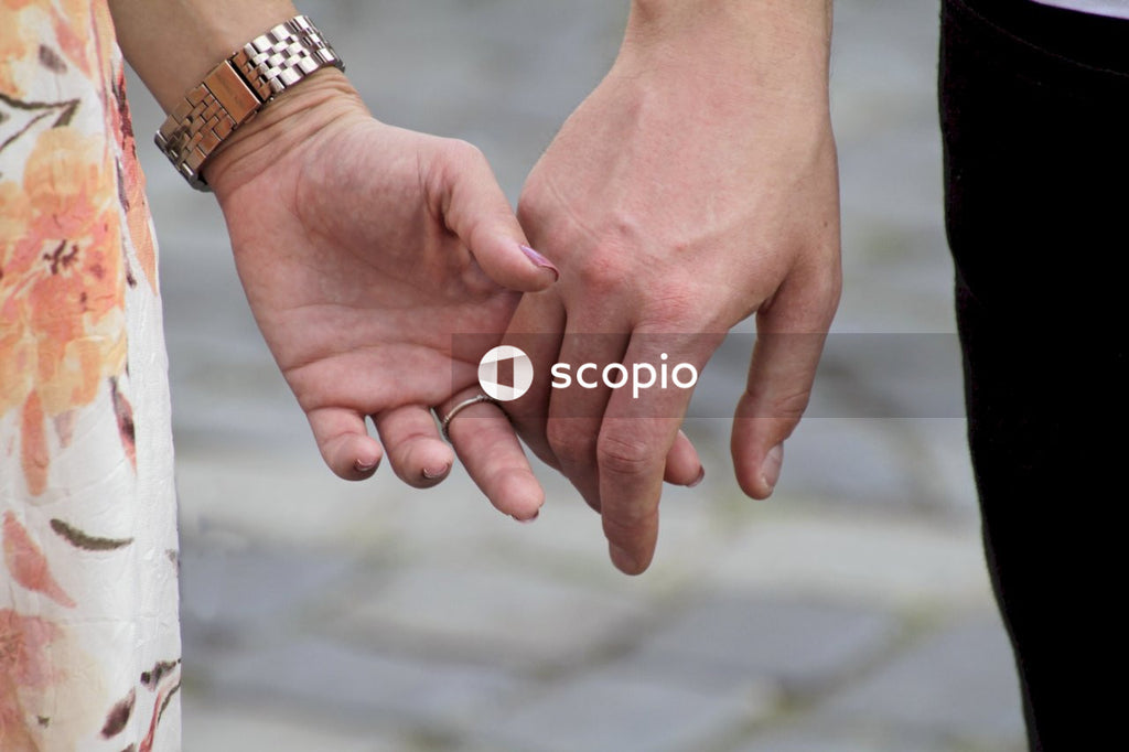 Man and a woman holding hands