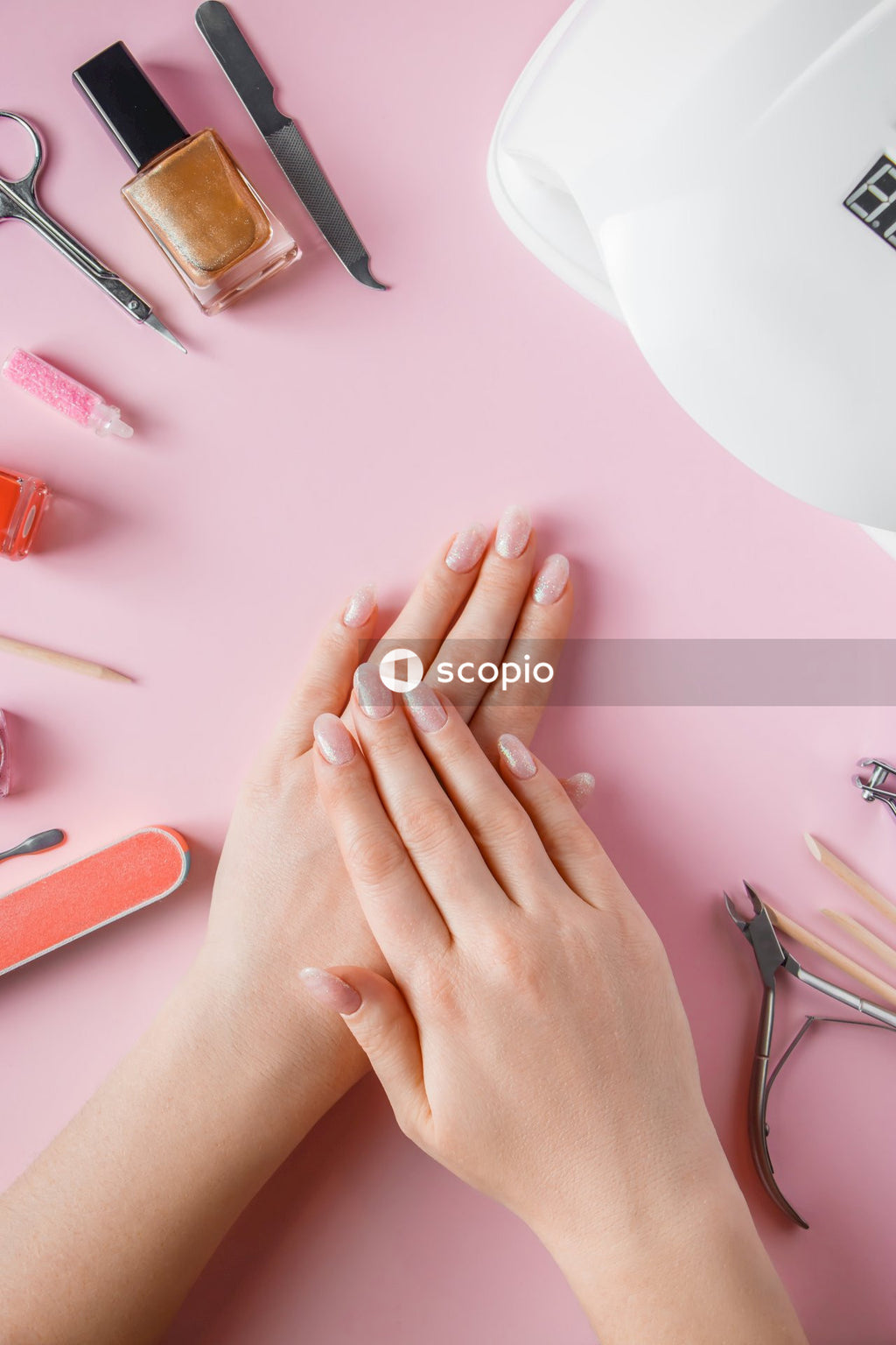 Persons hand on white table