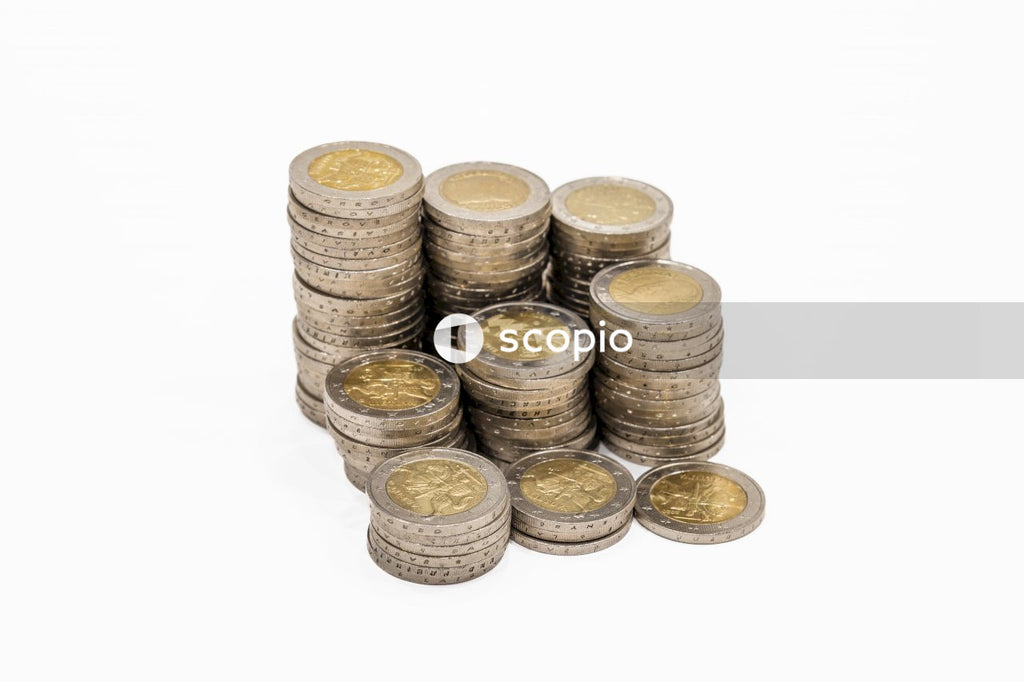 Pile of gold coins on white background