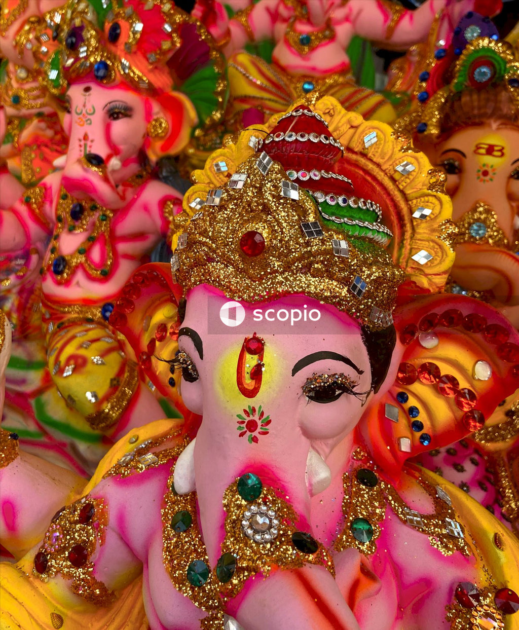 Pink and gold hindu deity figurine