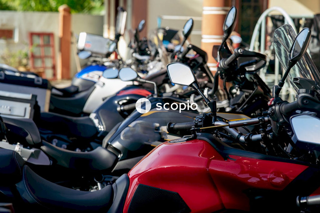 Red and black motorcycle parked on parking lot