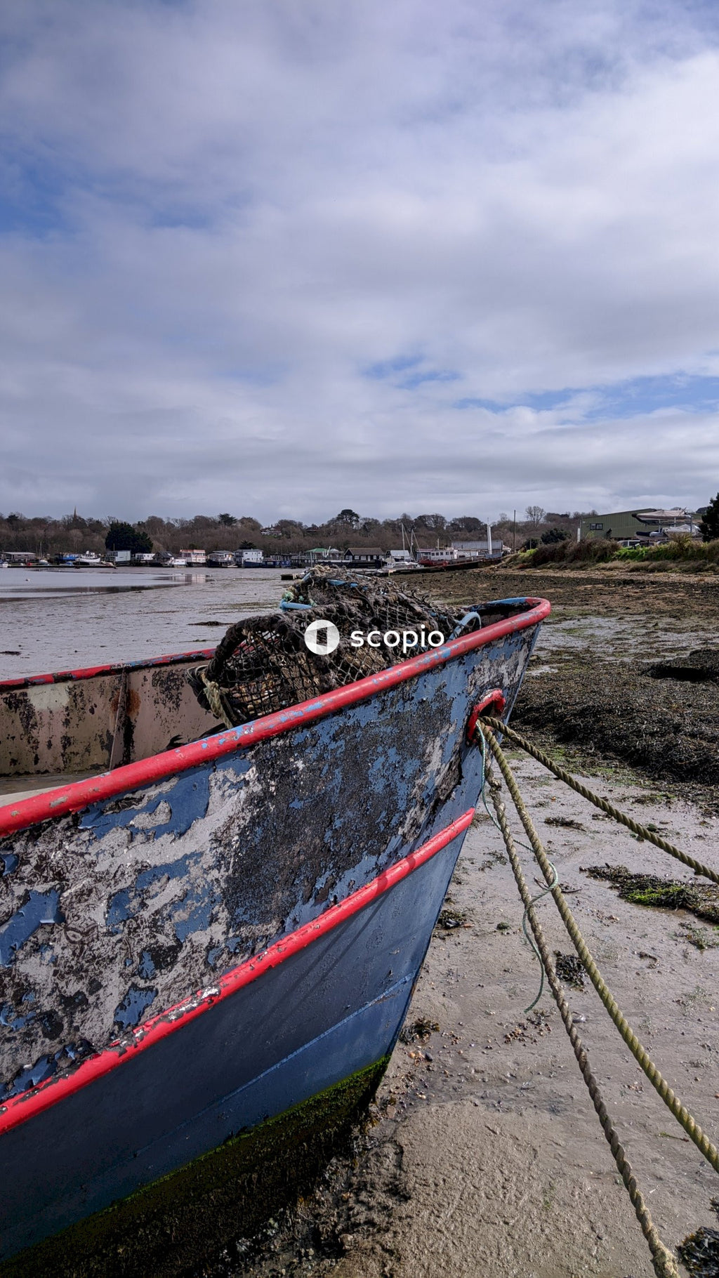 Red and white boat on seashore