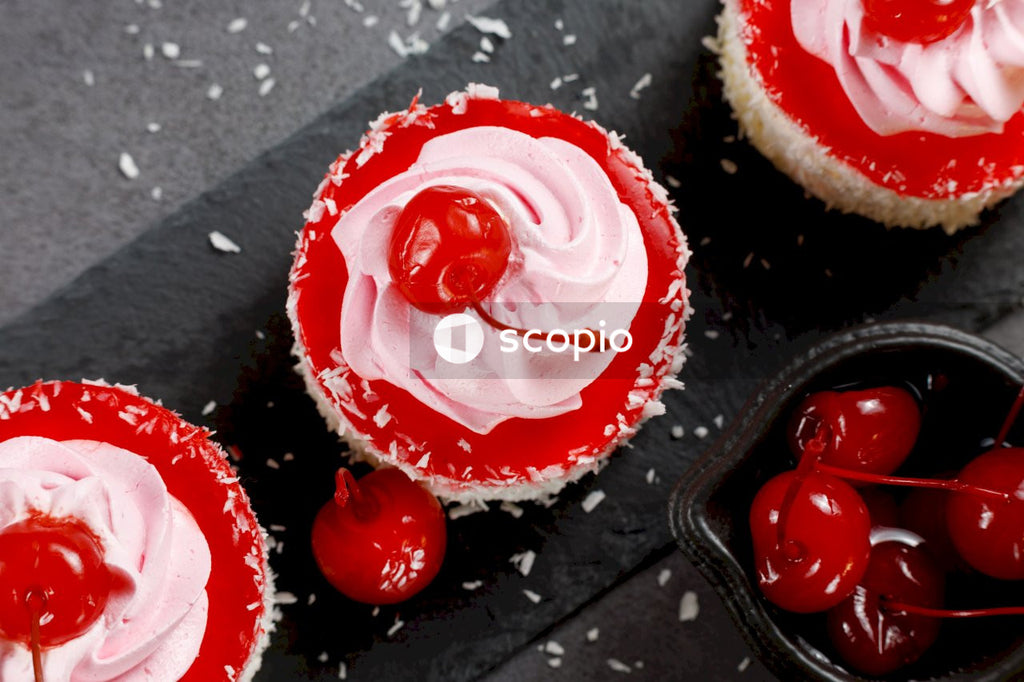Red and white icing on black surface