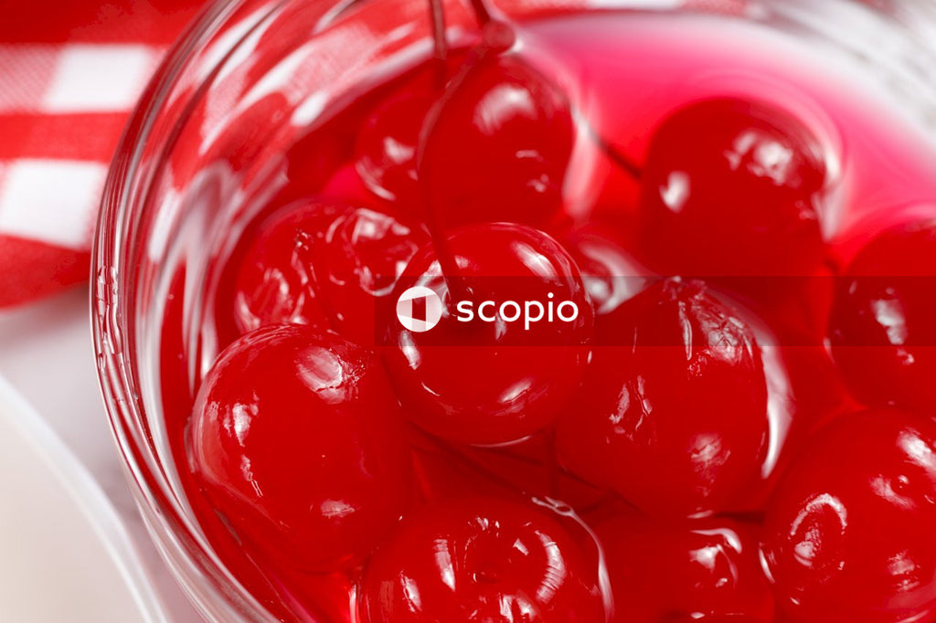 Red round candies in clear glass bowl