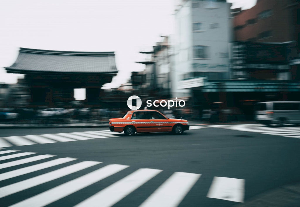 Red sedan on road