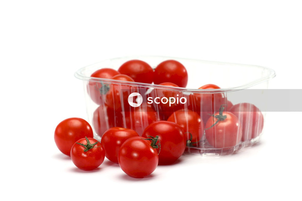 Red tomatoes in clear plastic container