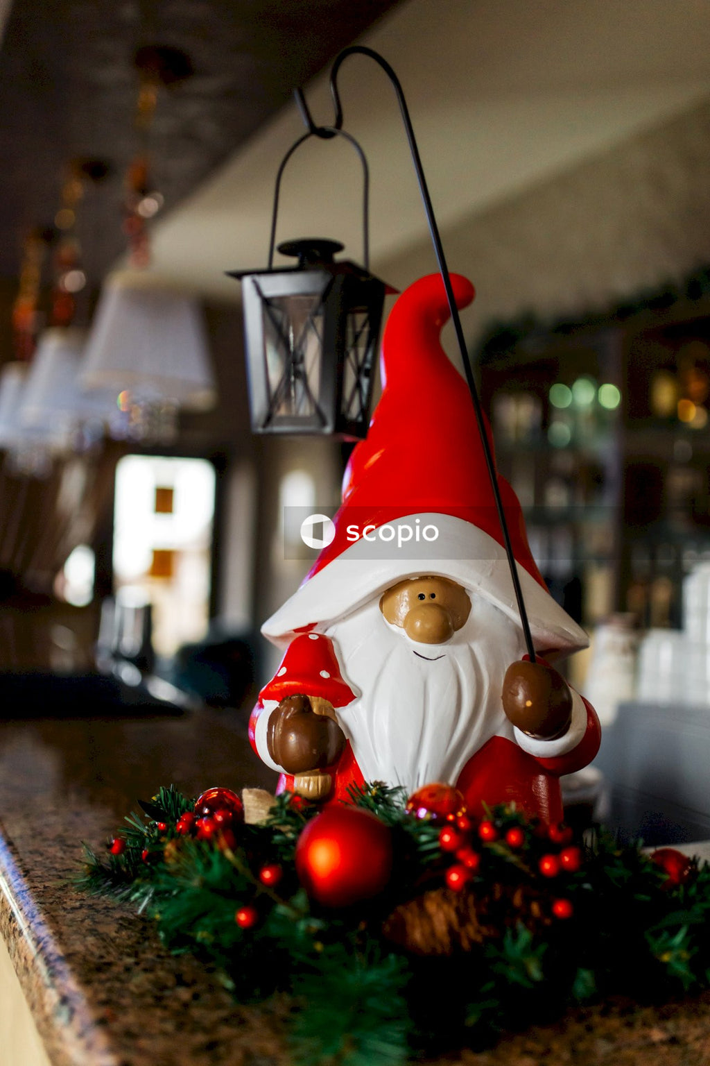 Santa claus figurine beside green christmas tree
