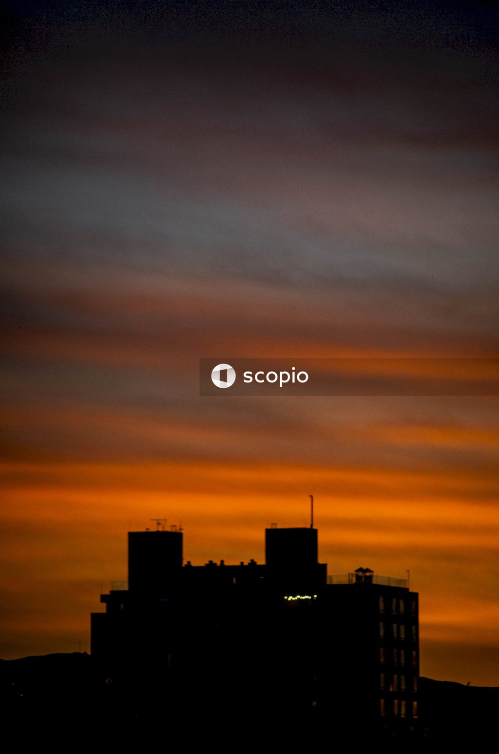 Silhouette of city buildings during sunset