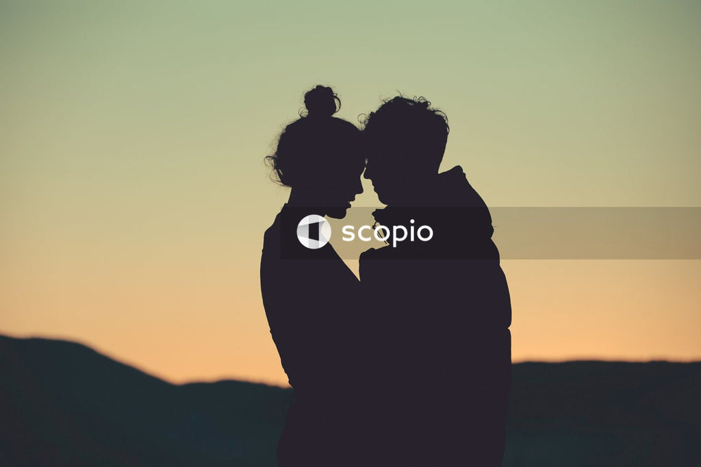 Silhouette of couple kissing during sunset