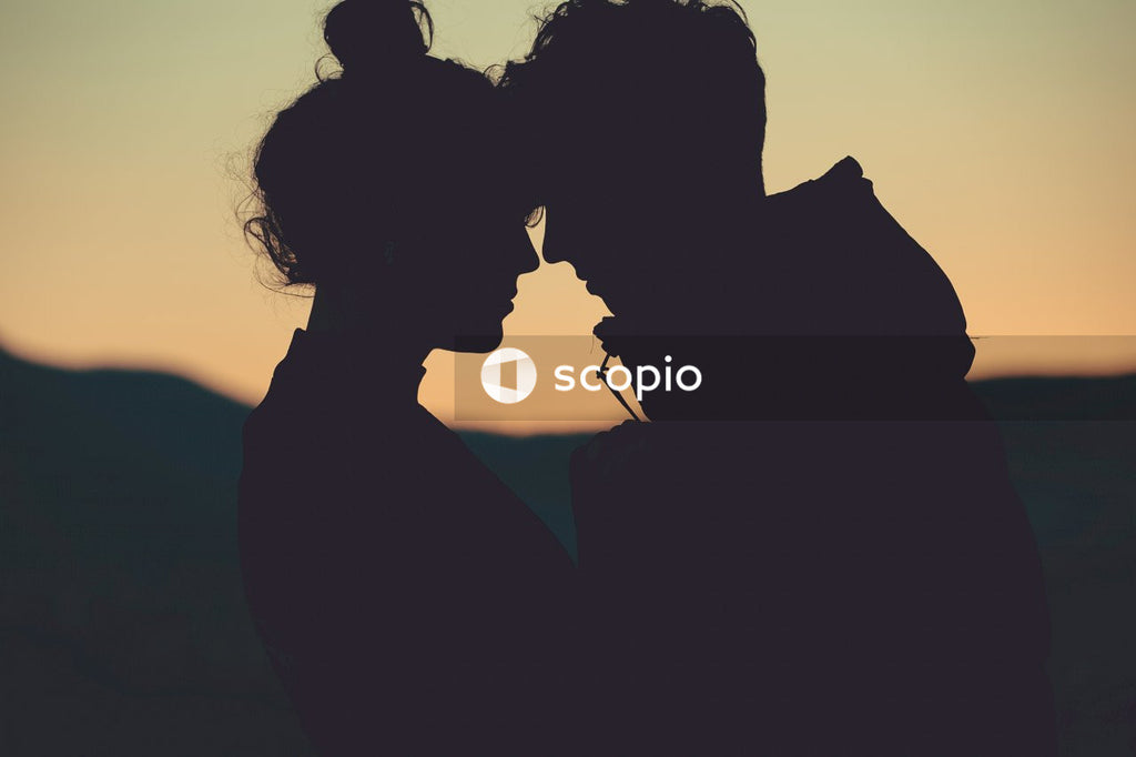 Silhouette of couple kissing during sunset