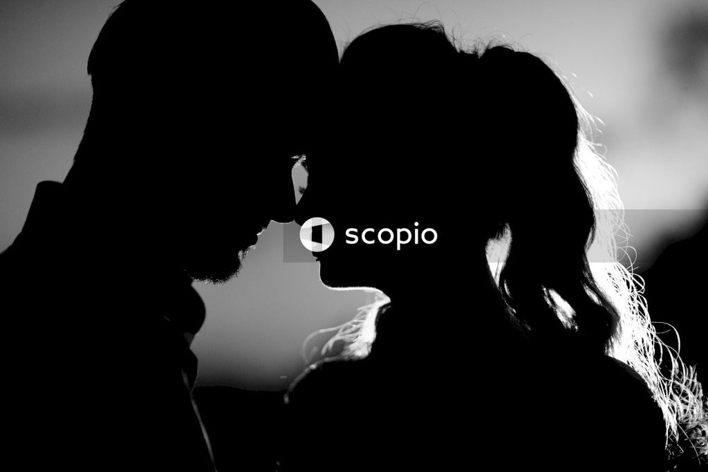 Silhouette of man and woman kissing
