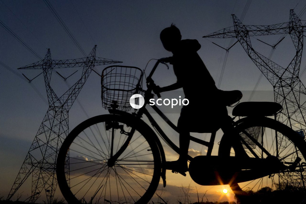 Silhouette of man riding bicycle during sunset
