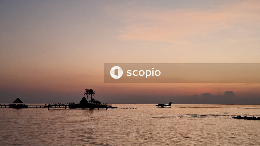 Silhouette of people riding boat on sea during sunset