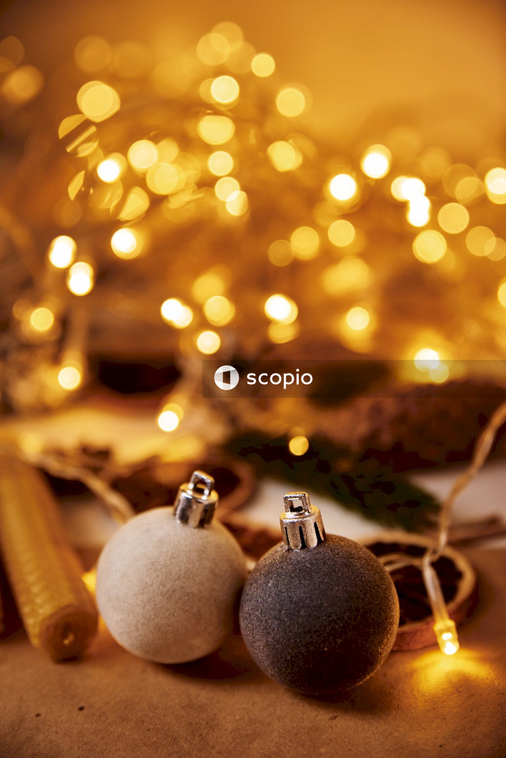 Silver baubles on brown wooden stick