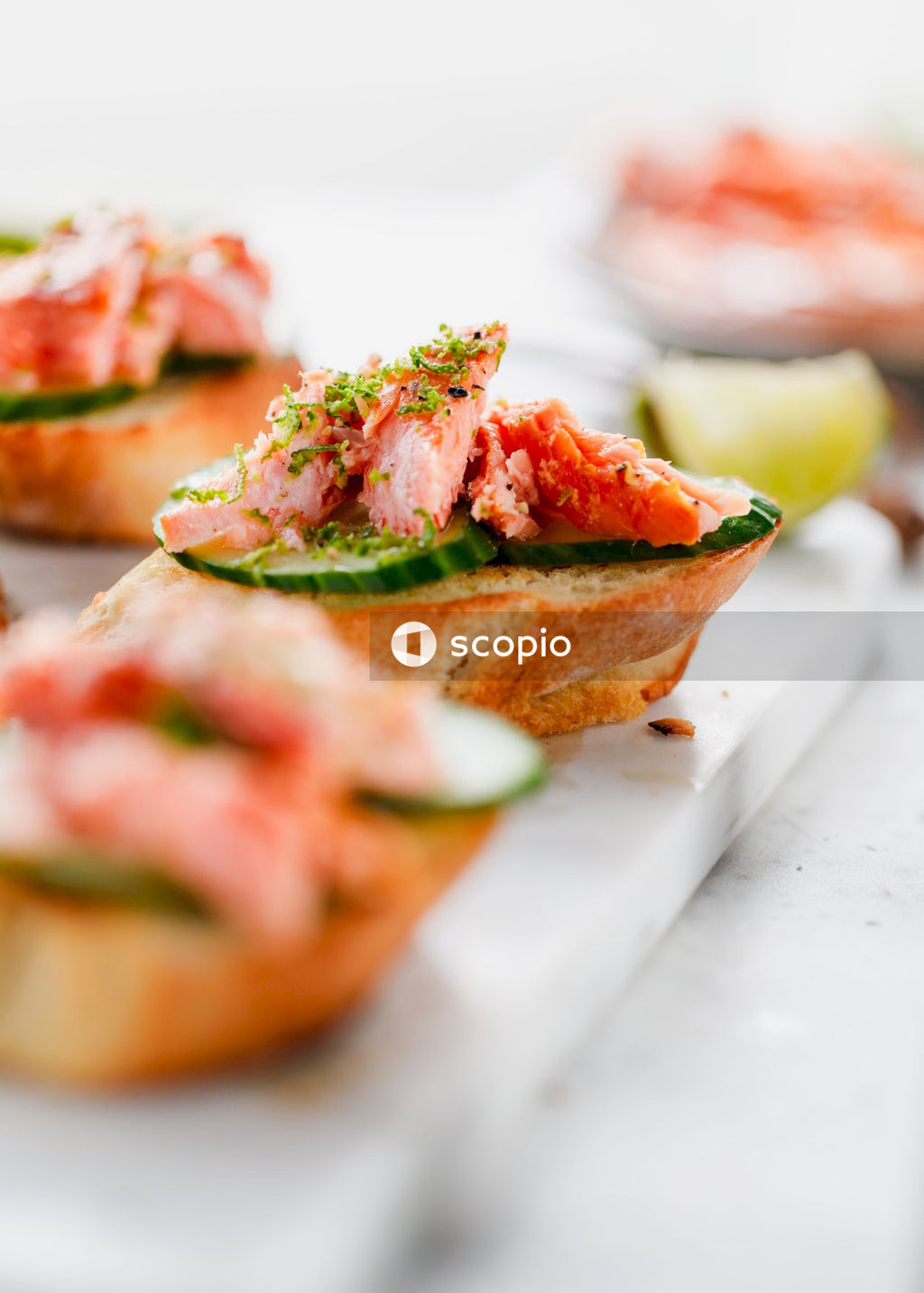 Sliced bread with ham and cheese on white ceramic plate