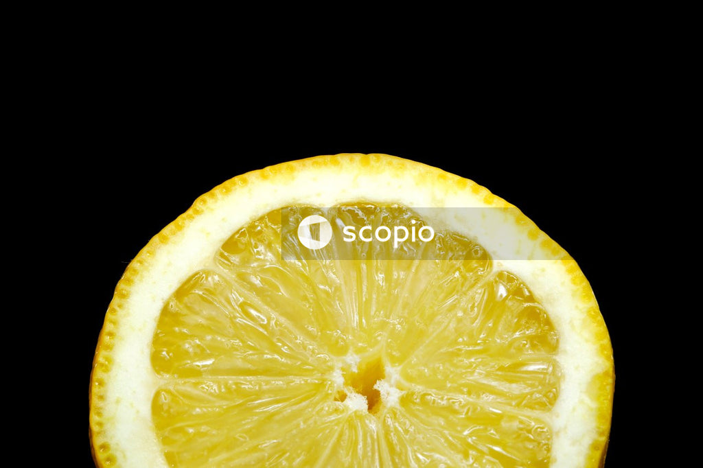 Sliced lemon fruit on black background