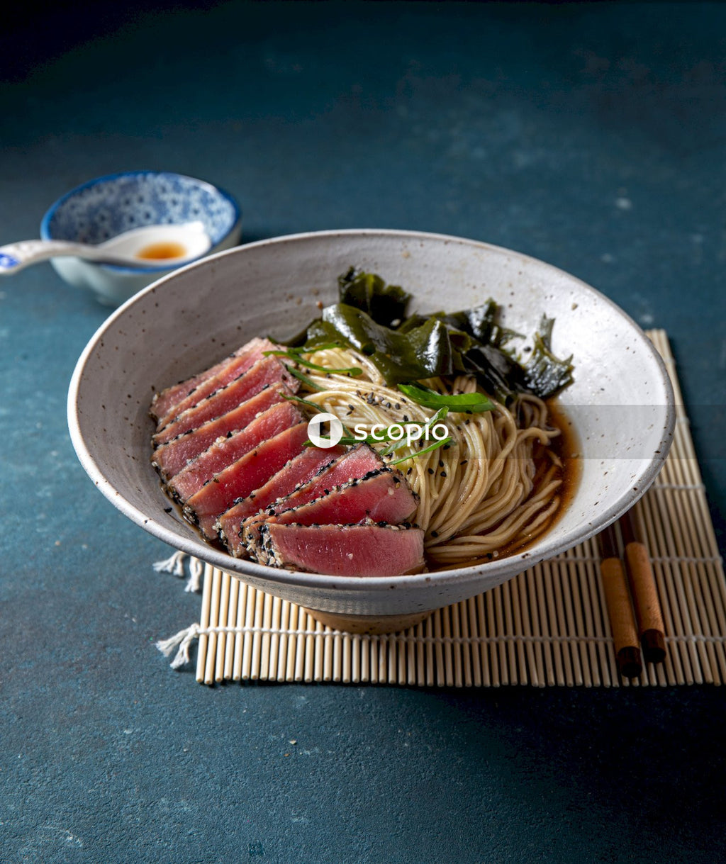 Sliced meat on white ceramic bowl