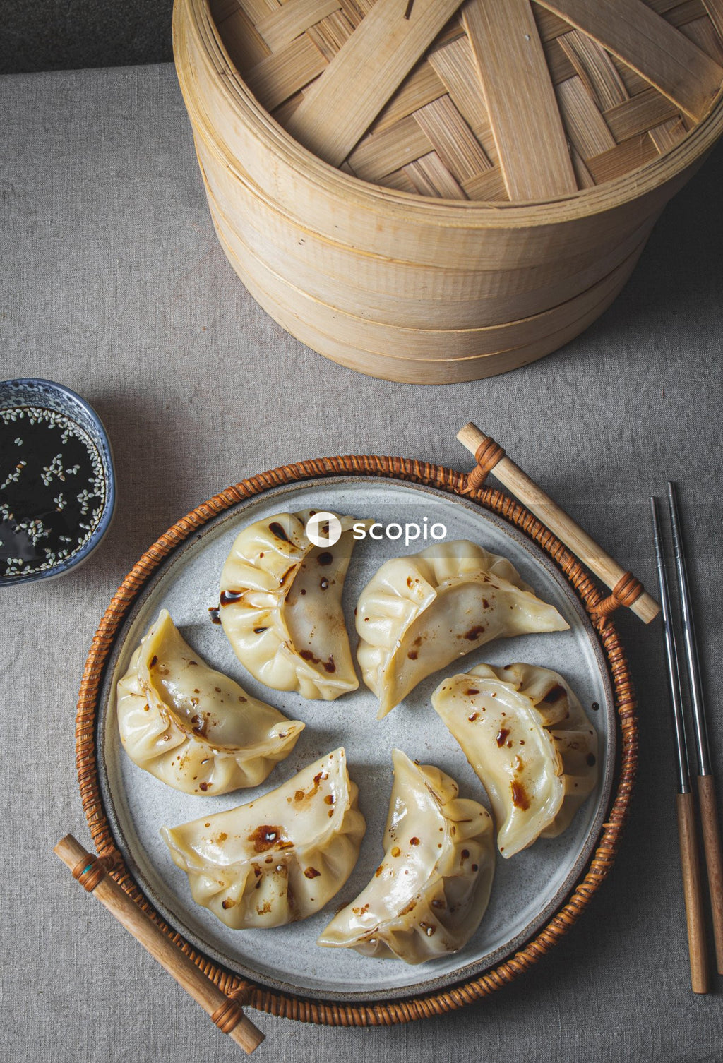 Sliced of bread on white ceramic plate beside brown wooden chopsticks