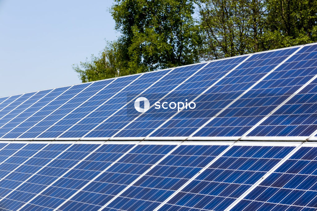 Solar panels on green grass field