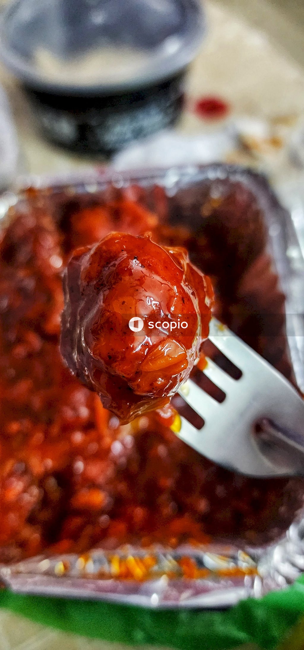 Stainless steel fork on brown food