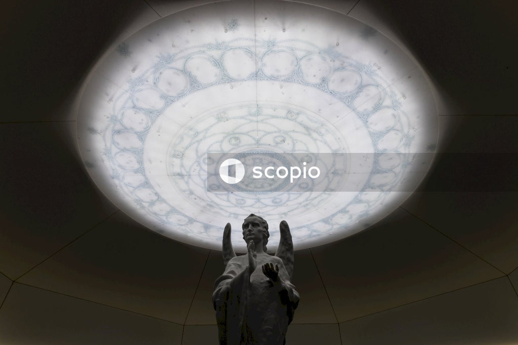 Statue of man raising his right hand