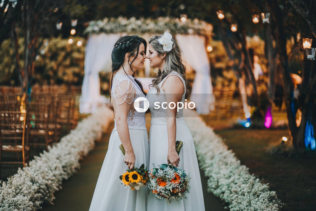 Two brides kissing at their wedding