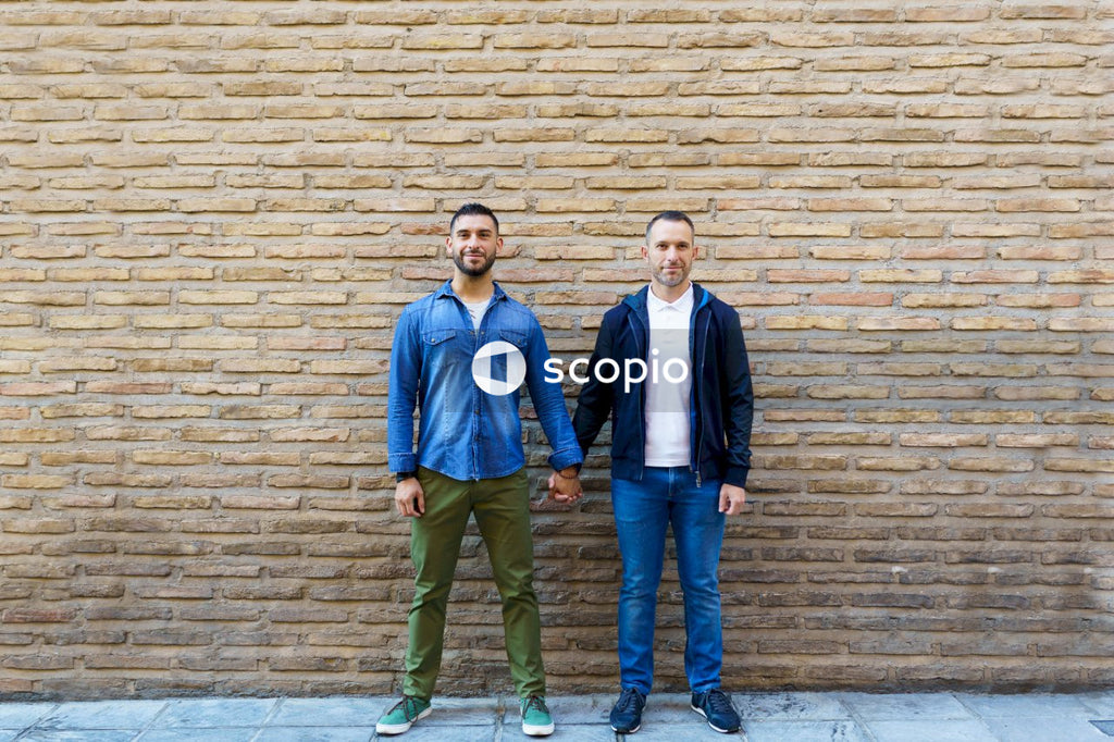 Two men holding hands outdoor