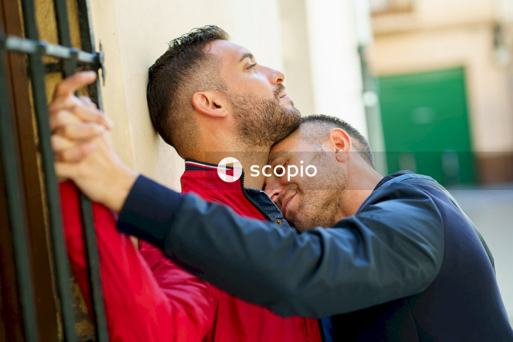 Two men kissing outdoor
