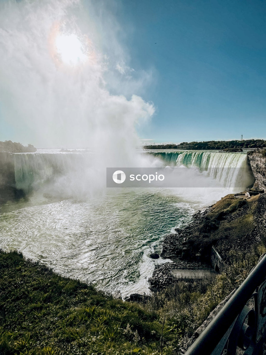 Waterfalls under blue sky and white clouds