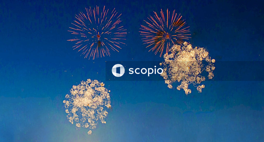 White and black fireworks on blue sky