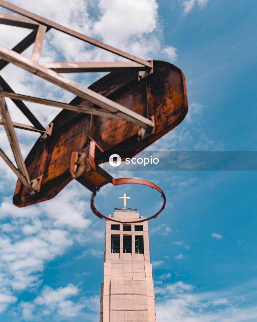 White and black metal tower under blue sky