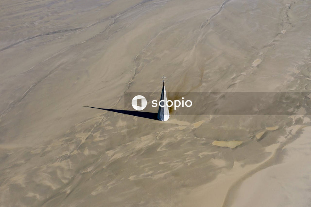 White and black plane on white sand