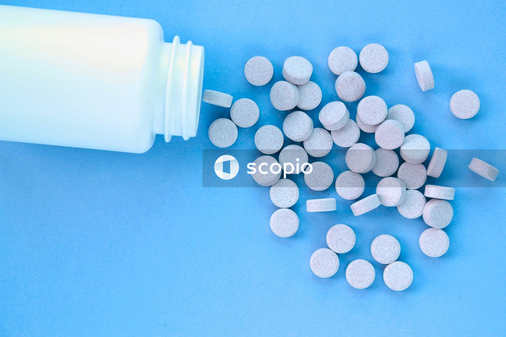 White and blue round medication pills