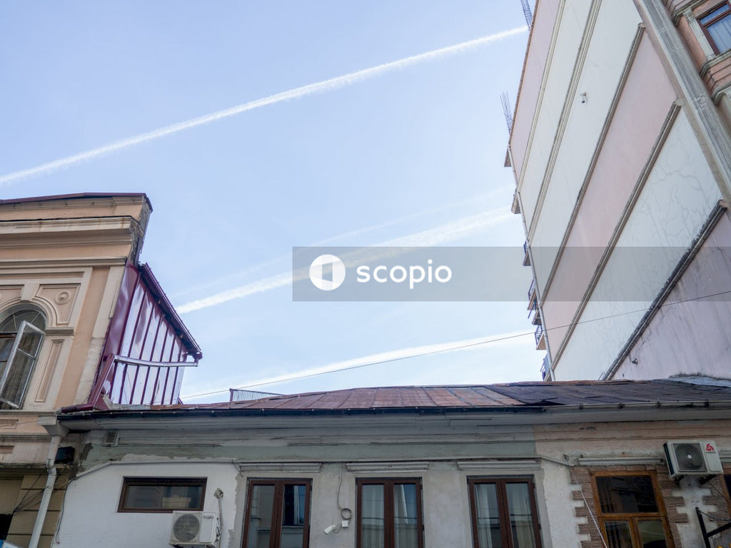 White and brown concrete house under blue sky