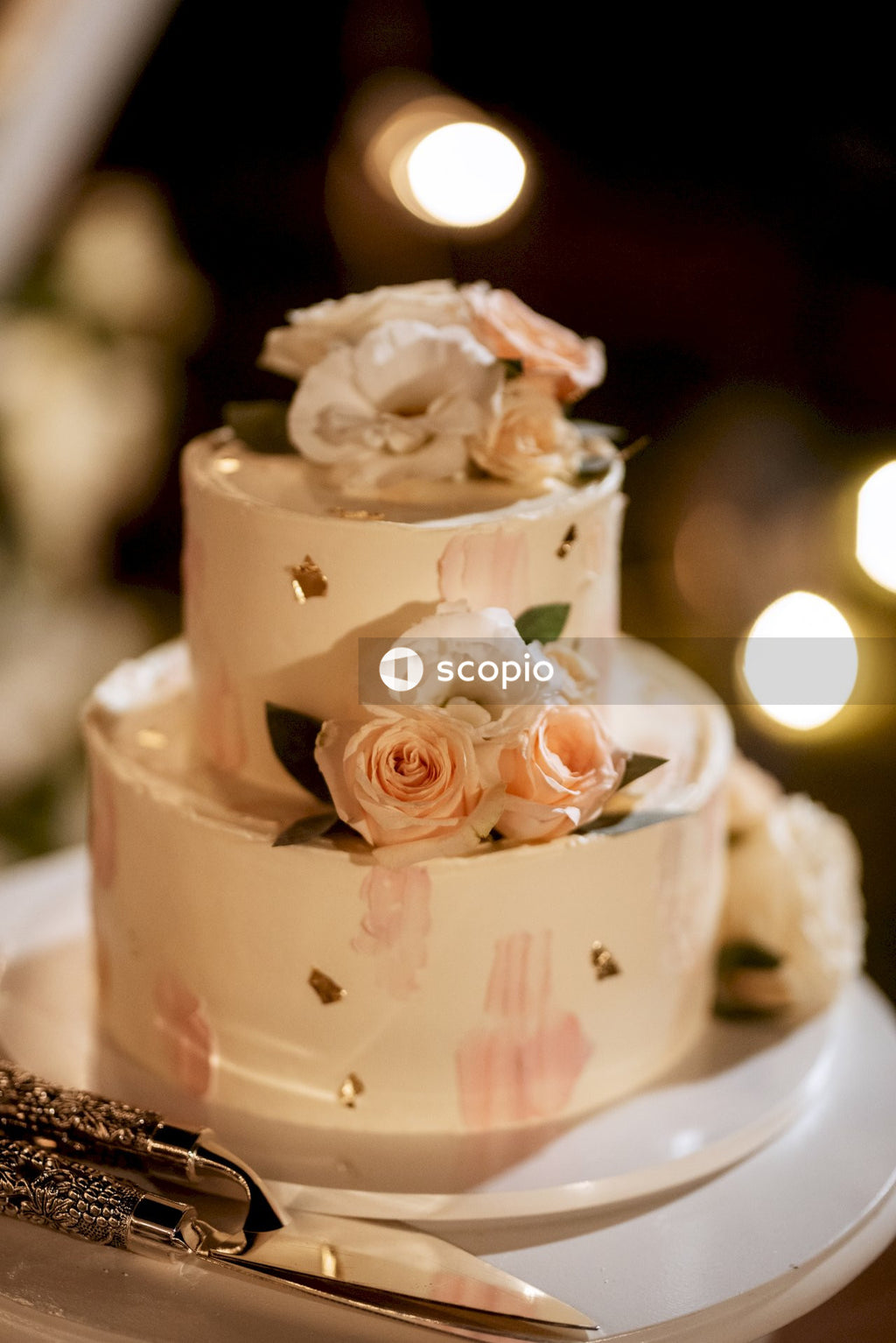 White and pink rose on white ceramic bowl