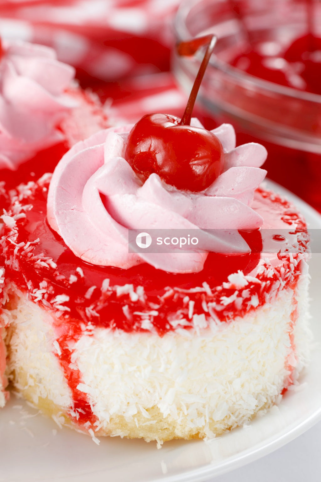 White and red cake with strawberry on top