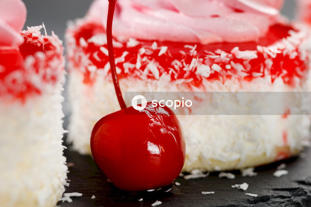 White and red candy on brown wooden table